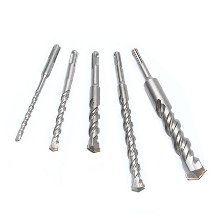 Two-groove, two-slot round shank hammer drill bit for enlarging holes in cement concrete through walls.
