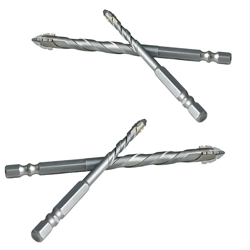 Dry drilling of ceramic tiles, glass, marble, and concrete with serrated drill bits and super hard alloys